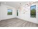 Bright living room featuring floral wallpaper, wood floors, recessed lighting, and natural light at 3310 Sunset N Dr, St Petersburg, FL 33710
