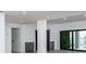 Modern living area with a wet bar with stainless appliances and a view of the water at 3310 Sunset N Dr, St Petersburg, FL 33710