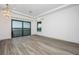 Bright living room featuring tray ceilings, water views, wood floors, and natural light at 3310 Sunset N Dr, St Petersburg, FL 33710