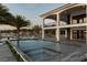 Stylish outdoor entertaining area features a gorgeous pool, jacuzzi, and stunning water view from the outdoor terrace at 3310 Sunset N Dr, St Petersburg, FL 33710