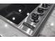 Close-up of a Viking stovetop, highlighting its smooth surface and refined knobs at 3310 Sunset N Dr, St Petersburg, FL 33710