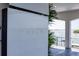 Tesla battery on the exterior wall of a home, showcasing energy efficiency and modern technology at 3310 Sunset N Dr, St Petersburg, FL 33710