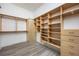 Bright walk-in closet featuring custom shelves, drawers, and ample storage space at 3310 Sunset N Dr, St Petersburg, FL 33710
