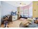 Bedroom area featuring light wood floors and a large bay window at 37110 Highland Bluff Cir, Dade City, FL 33523