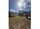 Expansive backyard with a lawn and screened-in pool area, great for Gathering and entertaining at 5404 Carso Ter, North Port, FL 34286