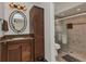 Spacious bathroom with a vanity, framed mirror, linen closet and enclosed walk-in shower at 5404 Carso Ter, North Port, FL 34286