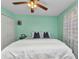 A spacious bedroom featuring carpeted floors, a ceiling fan, and lots of natural light at 5404 Carso Ter, North Port, FL 34286