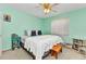 Bedroom with pastel walls, a white bed, stylish nightstand, and cozy carpet creates a relaxing space at 5404 Carso Ter, North Port, FL 34286