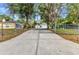 Long driveway leading to a detached garage, providing ample parking space at 5404 Carso Ter, North Port, FL 34286