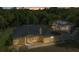 Charming single-story home featuring a dark roof and a lush, green landscape at 5404 Carso Ter, North Port, FL 34286