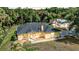 Charming single-story home with a well-maintained front yard and mature trees at 5404 Carso Ter, North Port, FL 34286