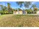 Charming single-story home with a large front yard and screened-in porch at 5404 Carso Ter, North Port, FL 34286