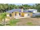 Inviting single-Gathering home featuring a well-manicured lawn and charming front entrance at 5404 Carso Ter, North Port, FL 34286