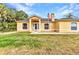 Inviting single-Gathering home featuring a well-manicured lawn and charming front entrance at 5404 Carso Ter, North Port, FL 34286