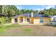 Inviting single-Gathering home featuring a well-manicured lawn and charming front entrance at 5404 Carso Ter, North Port, FL 34286