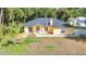Inviting single-Gathering home featuring a well-manicured lawn and charming front entrance at 5404 Carso Ter, North Port, FL 34286