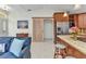 Open kitchen with stainless steel appliances and a sliding barn door to another room at 5404 Carso Ter, North Port, FL 34286