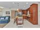 Spacious open kitchen featuring an island with a gas range and stainless steel appliances at 5404 Carso Ter, North Port, FL 34286