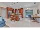 Open kitchen with stainless steel appliances, an island, and a view of the outdoor dining area and pool at 5404 Carso Ter, North Port, FL 34286