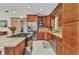 Beautiful kitchen with stainless appliances, wine rack, stone counters, and central island at 5404 Carso Ter, North Port, FL 34286