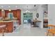 Bright kitchen with access to the outdoor pool area through sliding glass doors and island seating at 5404 Carso Ter, North Port, FL 34286