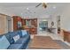 Bright living room open to the kitchen with views of the patio and stainless steel appliances at 5404 Carso Ter, North Port, FL 34286