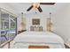 Bright and spacious main bedroom features an adjacent pool view and hardwood floors at 5404 Carso Ter, North Port, FL 34286