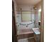 Vintage bathroom featuring a pink bathtub, white tile, and matching sink for a retro aesthetic at 8641 May Cir, Tampa, FL 33614