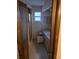 Bathroom showcasing a glass shower door, tile flooring, and vanity with storage space at 8641 May Cir, Tampa, FL 33614