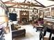 Inviting living room with a beamed ceiling, fireplace, and an array of decorative elements at 8641 May Cir, Tampa, FL 33614