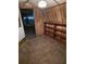 Inside the shed with paneled walls, shelving, and an open doorway to the outdoors at 8641 May Cir, Tampa, FL 33614