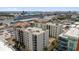 Aerial view showcases condo amenities and waterfront views with cruise ships in the background at 1238 E Kennedy Blvd # 802, Tampa, FL 33602