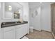 Modern bathroom featuring white cabinetry, granite countertops, tile floors, and a glass-enclosed shower at 1238 E Kennedy Blvd # 802, Tampa, FL 33602