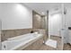 Modern bathroom with a soaking tub and a separate tiled shower at 1238 E Kennedy Blvd # 802, Tampa, FL 33602