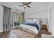 Bright bedroom with balcony access, wood floors and elegant decor at 1238 E Kennedy Blvd # 802, Tampa, FL 33602