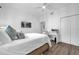 Well-lit bedroom with a large bed, workspace and hardwood floors with a closet in the corner at 1238 E Kennedy Blvd # 802, Tampa, FL 33602