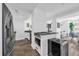 Modern kitchen flows into the living area with a view of the outside at 1238 E Kennedy Blvd # 802, Tampa, FL 33602