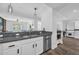 Modern kitchen boasts stainless appliances, white cabinets and wood floors at 1238 E Kennedy Blvd # 802, Tampa, FL 33602