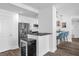 Condo kitchen with stainless appliances, granite counters, white cabinetry and stylish lighting at 1238 E Kennedy Blvd # 802, Tampa, FL 33602