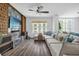 Living room with large windows, fan, and modern decor and furnishings at 1238 E Kennedy Blvd # 802, Tampa, FL 33602