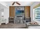 Bright living room featuring modern media center, wood floors, decorative lighting and views of the city at 1238 E Kennedy Blvd # 802, Tampa, FL 33602