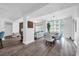 A spacious living space with hardwood floors, big windows, and open floor plan that connects the dining and living areas at 1238 E Kennedy Blvd # 802, Tampa, FL 33602