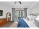 Bright main bedroom with wood floors and stylish decor, offering a comfortable retreat at 1238 E Kennedy Blvd # 802, Tampa, FL 33602