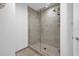 Shower features glass doors, neutral tiling, and a rain shower head at 1238 E Kennedy Blvd # 802, Tampa, FL 33602