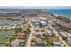 Panoramic aerial view showcasing the neighborhood, a serene waterfront, and the beautiful Gulf Coast at 15406 2Nd E St, Madeira Beach, FL 33708