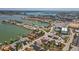 Aerial view showcasing the waterfront neighborhood, marina, and a glimpse of the Gulf at 15406 2Nd E St, Madeira Beach, FL 33708