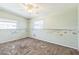 Light-filled bedroom needing repair, offering natural light from windows at 15406 2Nd E St, Madeira Beach, FL 33708