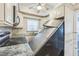 Inviting kitchen boasting ample cabinet space, granite countertops, and modern appliances, making it a chef's delight at 15406 2Nd E St, Madeira Beach, FL 33708