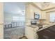 Open-concept kitchen with modern stainless steel appliances and ample cabinet space, seamlessly flowing into the adjacent living area at 15406 2Nd E St, Madeira Beach, FL 33708