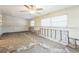 Bright room with ceiling fan needing full remodel and restoration after significant damage at 15406 2Nd E St, Madeira Beach, FL 33708